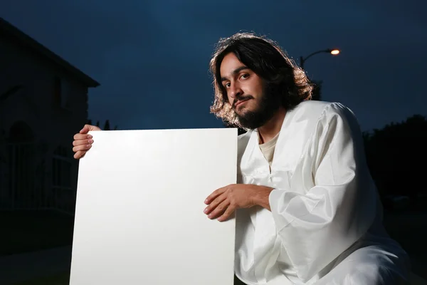 Jesus håller en tom vit affisch — Stockfoto