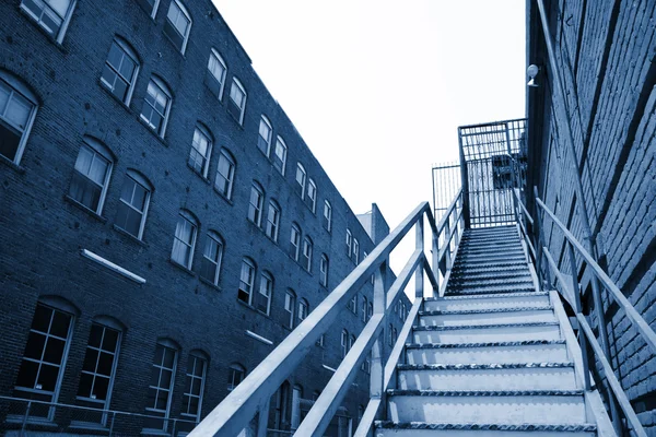 Stairway going up in an old downtown building — Stock Photo, Image