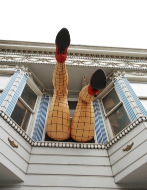 Legs sticking out the window on Haight street. clipart