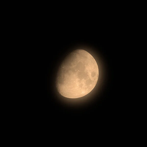 Moon two thirds 66%  phase photographed through a long focal telescope.