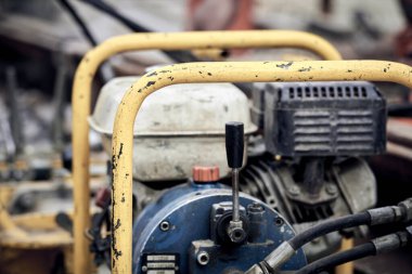 Construction compressor machine on the road reconstruction.