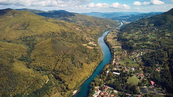 Drone aerial footage of river Drina and Tara mountain hilly landscape in Serbia.