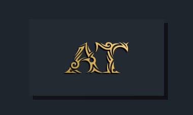 Luxury initial letters AT logo design. It will be use for Restaurant, Royalty, Boutique, Hotel, Heraldic, Jewelry, Fashion and other vector illustration
