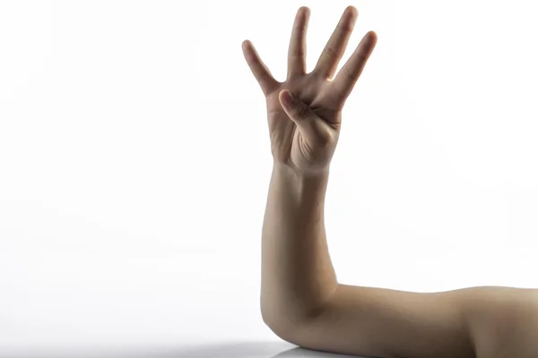 Joven manos haciendo número 4 signo — Foto de Stock