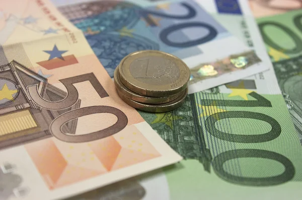 Euro banknotes and coins — Stock Photo, Image