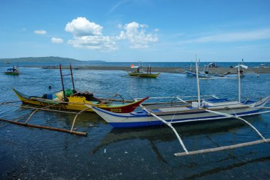 San Jose, Philippines - May 2022: Fishing boats on the beach of San Jose on May 3, 2022 in San Jose, Occidental Mindoro, Philippines.