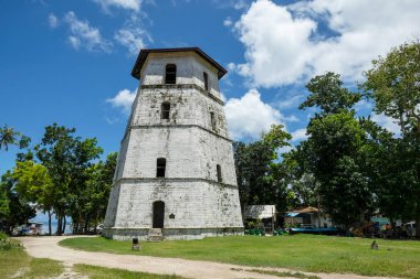 Panglao, Philippines - June 2022: The Panglao Watchtower is a five-storey, hexagonal tower with a pitched roof cover, erected in 1851 within the church complex of San Agustin Parish Church on June 24, 2022 in Bohol, Philippines.