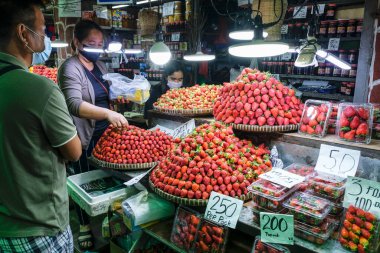 Baguio, Philippines - August 2022: Strawberry stand in Baguio market on August 4, 2022 in Baguio, Luzon, Philippines.