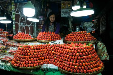 Baguio, Philippines - August 2022: Strawberry stand in Baguio market on August 4, 2022 in Baguio, Luzon, Philippines.