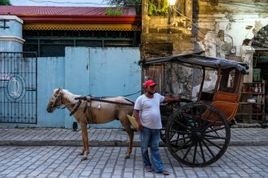 Vigan, Philippines - August 2022: Views of Crisologo street in Vigan, it is a UNESCO World Heritage Site and it is one of the few Spanish colonial towns left in the Philippines on August 6, 2022 in Vigan, Luzon, Philippines.