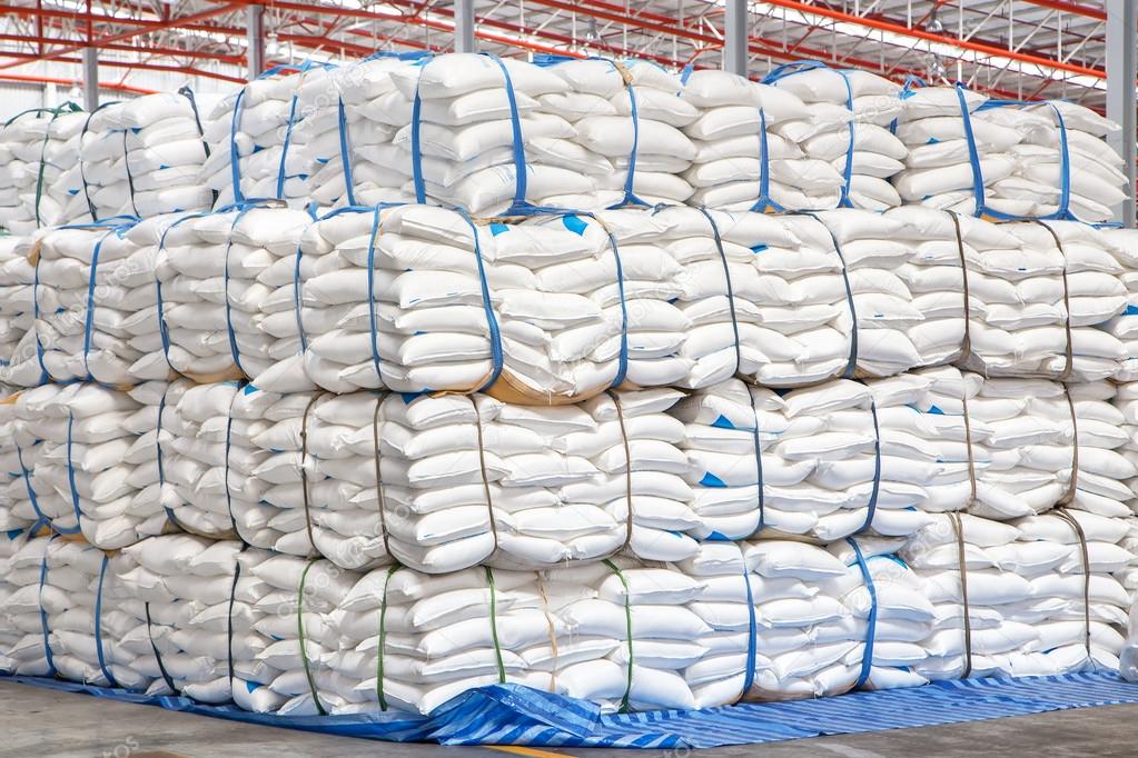 stacked sacks of meal in warehouse waiting for transportation
