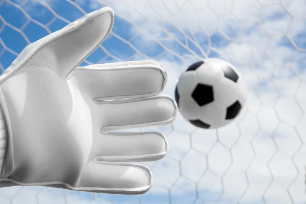 Goalkeeper's hands fail catching the soccer ball with net and bl — Stock Photo, Image