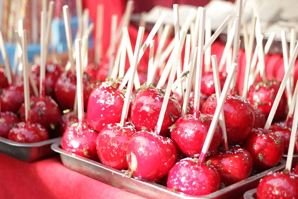 Candied apples covered with wasps