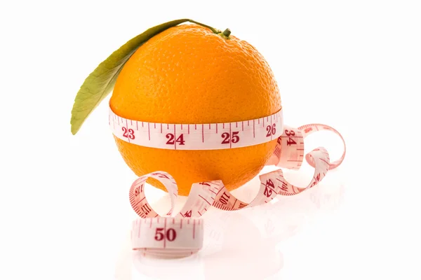 Orange fruit and measuring tape — Stock Photo, Image