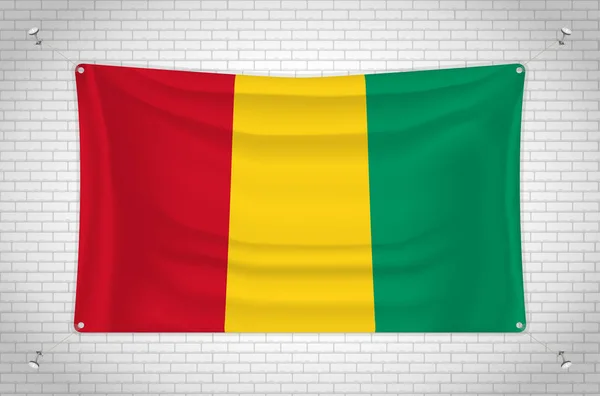 Guinea Flag Hanging Brick Wall Drawing Flag Attached Wall Neatly — Vetor de Stock