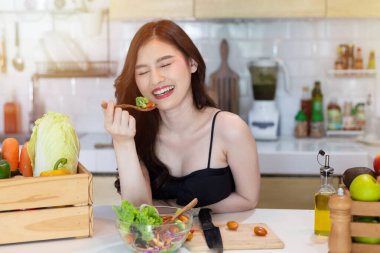 Beautiful Asian Woman smiling preparing vegetable salad in the kitchen Healthy FoodsVegan SaladsVegetarian SaladFood IdeasDiet IdeasHealthy LifestyleCooking At Home