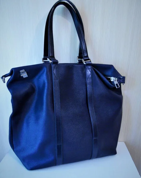 women\'s large leather bag dark blue on a light background