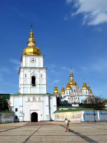 Mikhailovsky Golden-Domed Cathedral in the city of Kyiv, Ukraine. Man goes to the temple