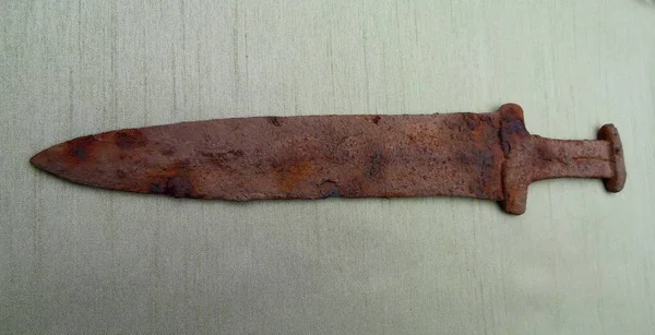akinak - Scythian sword, Scythian dagger of the early Iron Age 3-5 centuries BC on a green cloth,  ancient Scythian dagger