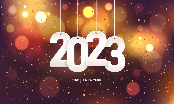 Mutlu yıllar 2023. Renkli, bulanık bir arkaplanda konfeti ile beyaz kağıt numarası asmak.
