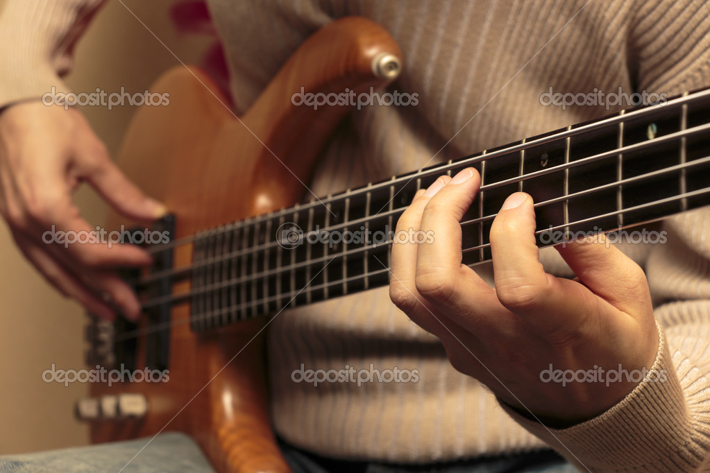 Closeup Photo Of Bass Guitar Player Stock Photo - Download Image