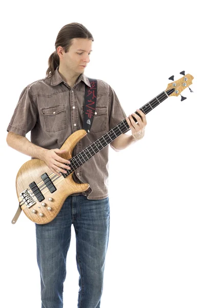 Bass guitarist playing a bass guitar — Stock Photo, Image