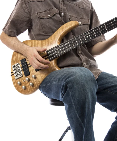 Bassist playing a bass guitar — Stock Photo, Image