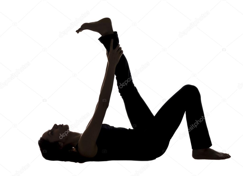 Woman doing Reclining Leg Stretching in Yoga, Silhouette View