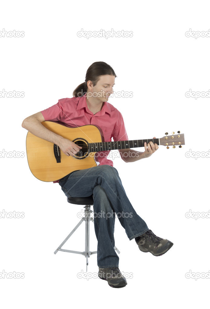 Young guitarist playing acoustic guitar