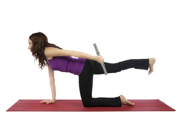 Fitness woman doing kneeling triceps kickback — Stock Photo, Image