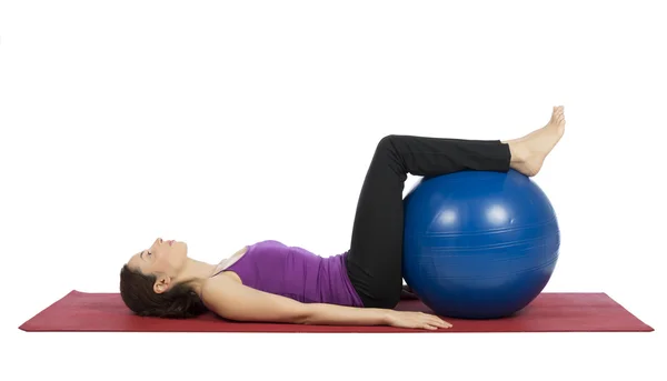 Woman doing fitness with a pilates ball Royalty Free Stock Photos