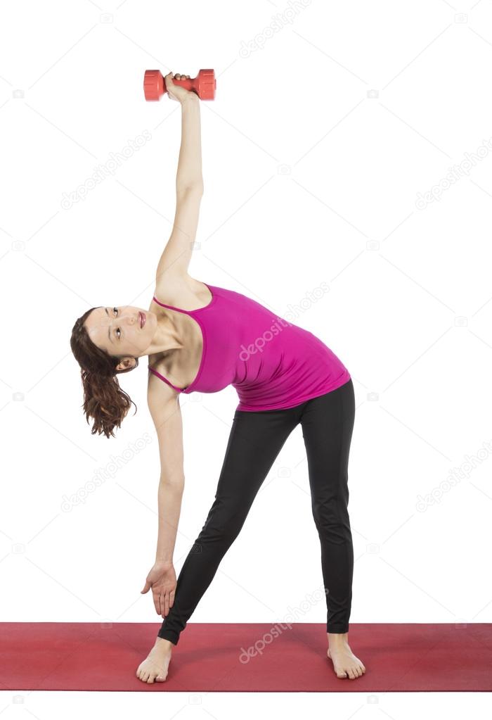 Woman lifting weight in triangle pose
