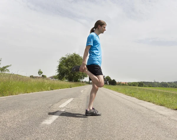 धावणारा माणूस ताणून — स्टॉक फोटो, इमेज