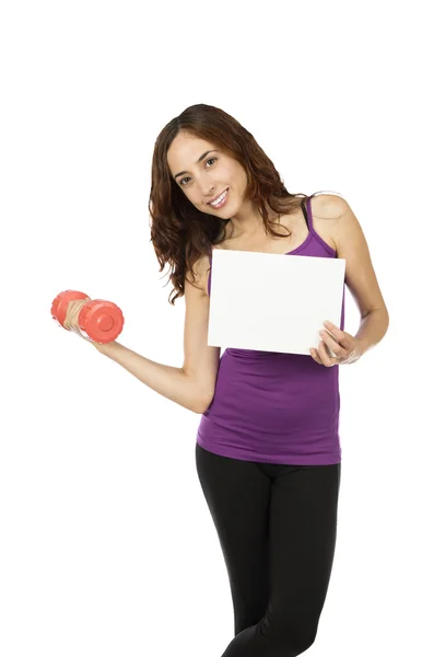 Fitness woman showing an advertisement board. — Stock Photo, Image