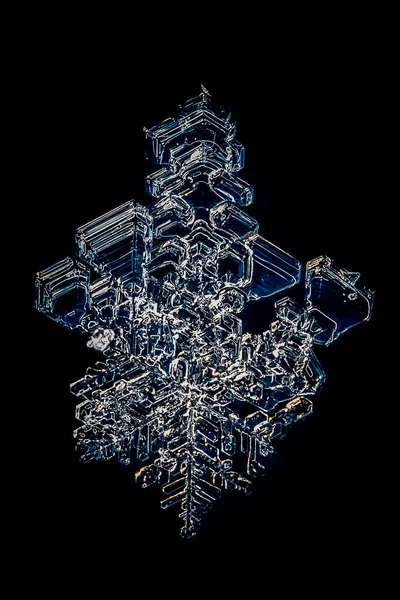 Ice crystal macro on a black background. Ice crystal macro.