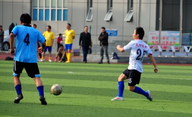 China: Chinese Soccer Team at Pengzhou Stadium clipart