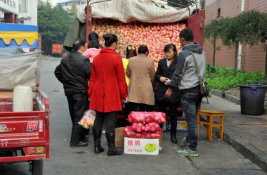 Pengzhou, China: People Buying Apples from Truck clipart