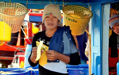 Bang Saen, Thailand: Thai Fisherman Eating Banana clipart