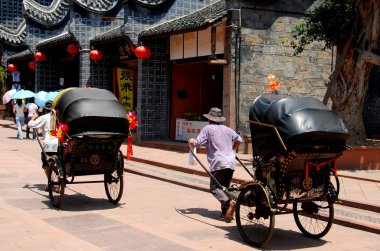 dai, Luo Çin: erkekler rickshaws çekerek
