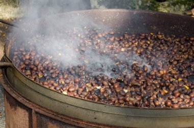 roasted chestnuts cooked on the grill in autumn