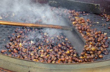 roasted chestnuts cooked on the grill in autumn