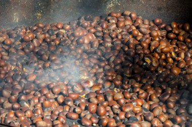 roasted chestnuts cooked on the grill in autumn
