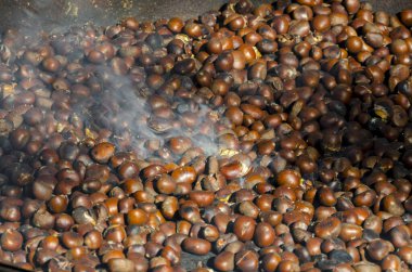 roasted chestnuts cooked on the grill in autumn