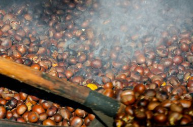 roasted chestnuts cooked on the grill in autumn