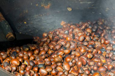 roasted chestnuts cooked on the grill in autumn