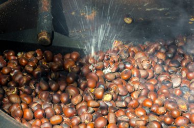 roasted chestnuts cooked on the grill in autumn