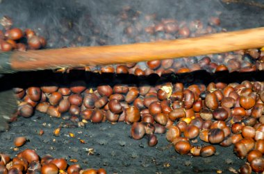 roasted chestnuts cooked on the grill in autumn