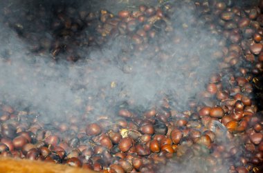 roasted chestnuts cooked on the grill in autumn