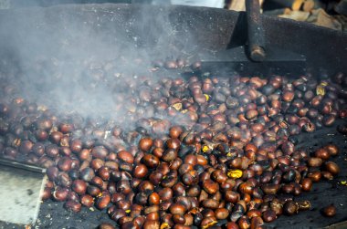 roasted chestnuts cooked on the grill in autumn