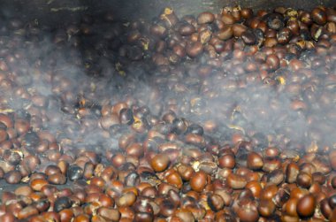 roasted chestnuts cooked on the grill in autumn